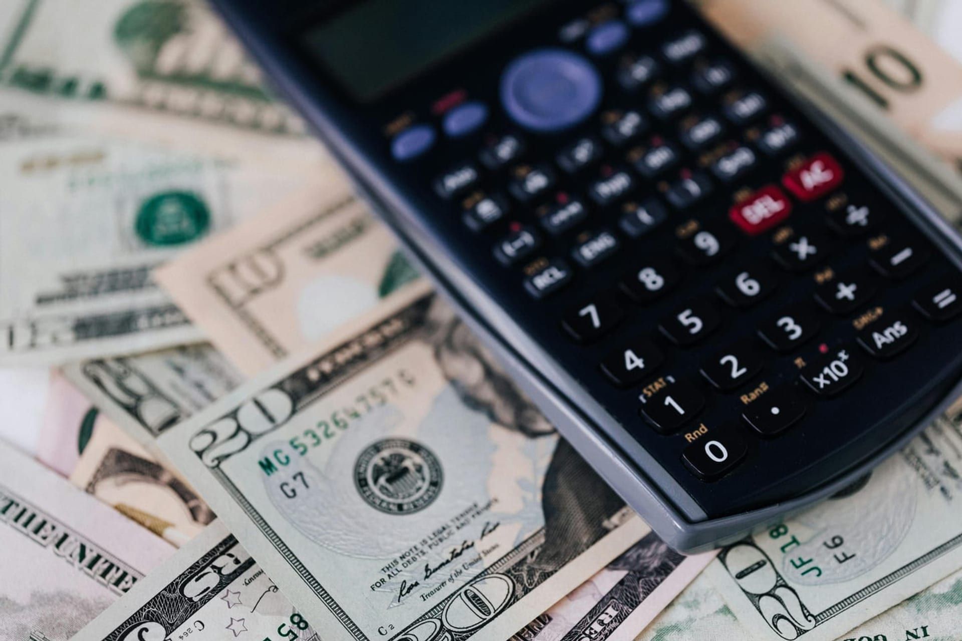 Pay stubs and a calculator representing wage-replacement benefits