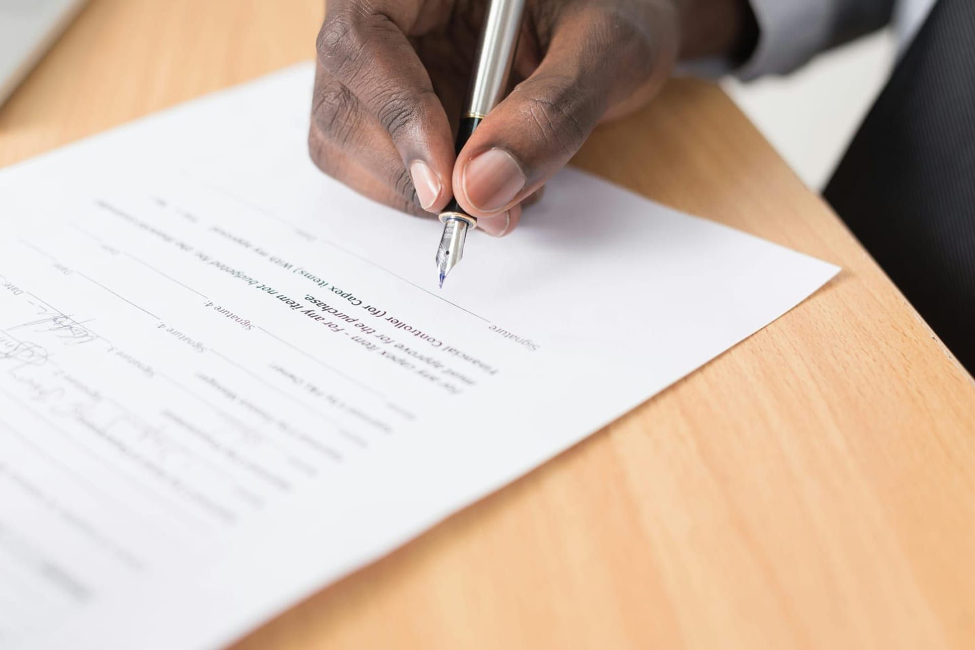 Document signing paperwork on a desk